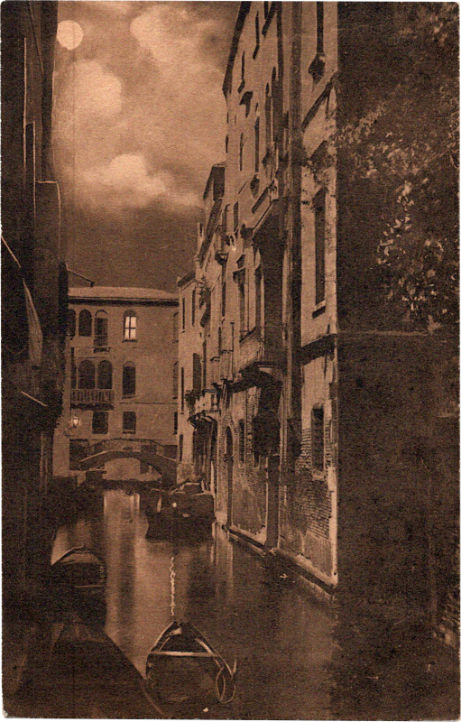 a water canal with buildings and a bridge