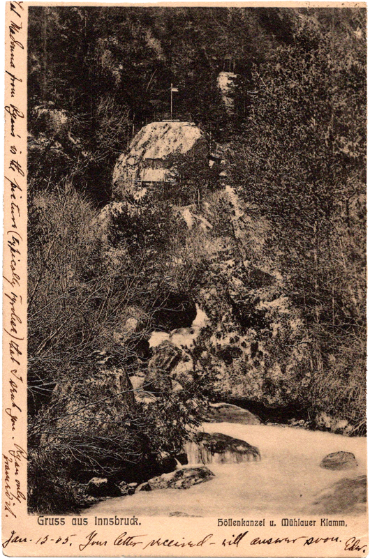 a rock with a river in the background