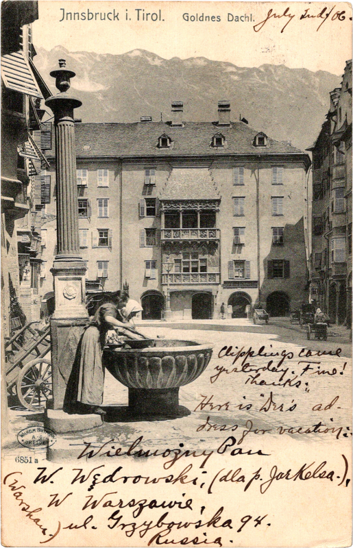 a person washing her hands in a large fountain