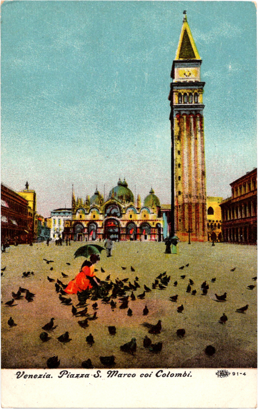 a person sitting in a square surrounded by birds