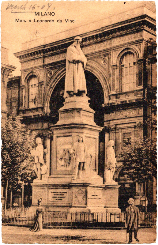 a statue of a person in front of a building