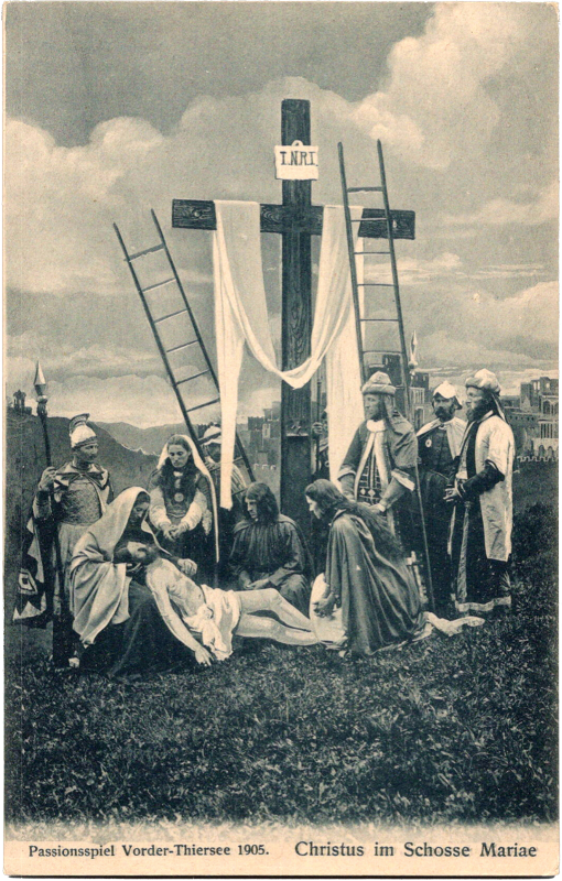 a group of people around a cross