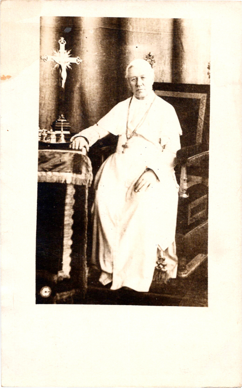 the pope sitting in a chair