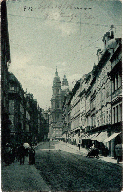 a street with buildings and a horse carriage