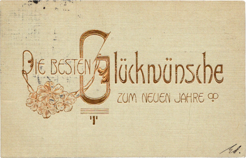 a postcard with embossed gold text