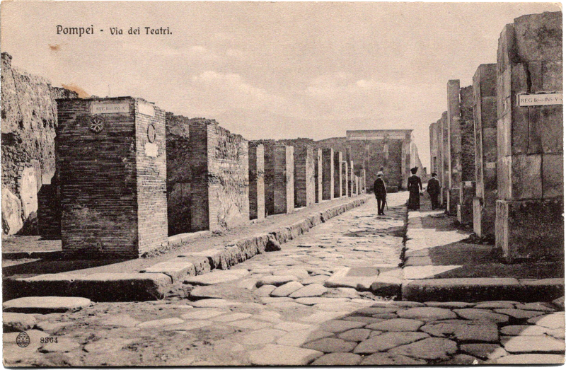 a group of people walking on a stone path