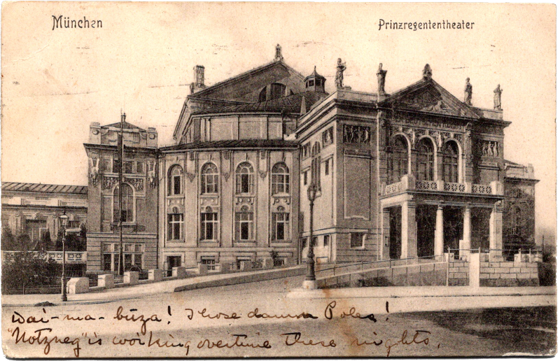 a building with columns and statues on top of it