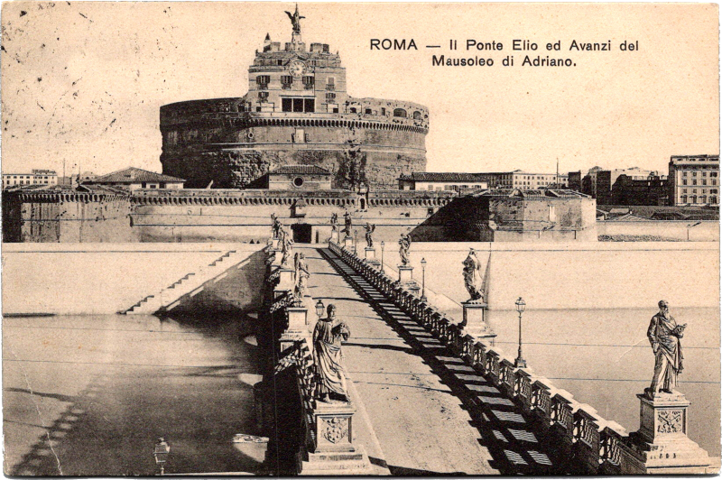 a bridge over water with a large round building