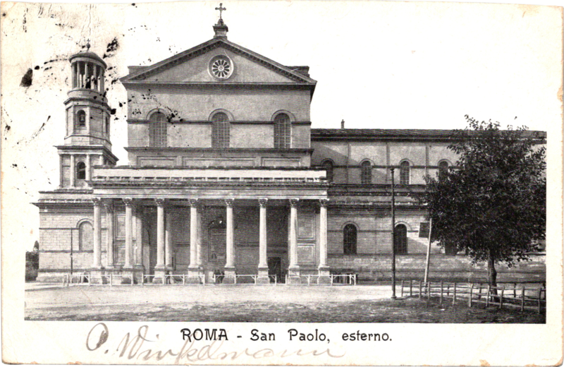 a building with columns and a clock