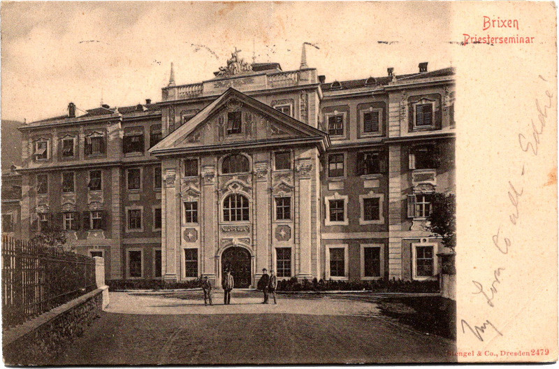 a large building with people standing outside