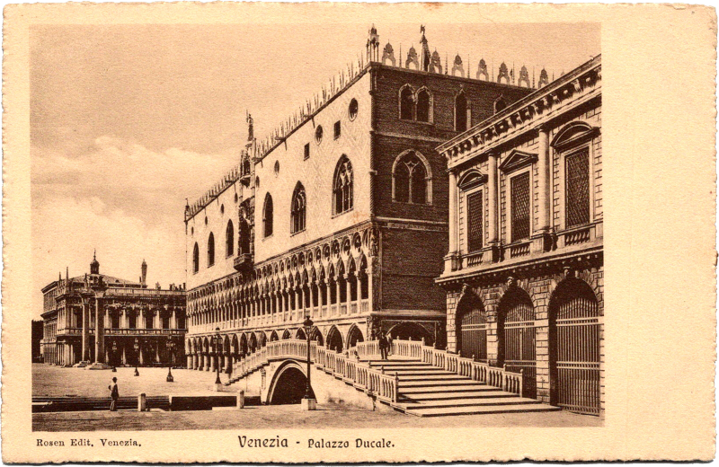 a large building with arches and a bridge