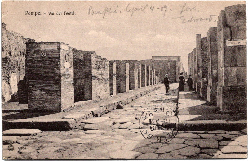 a group of people walking on a stone path