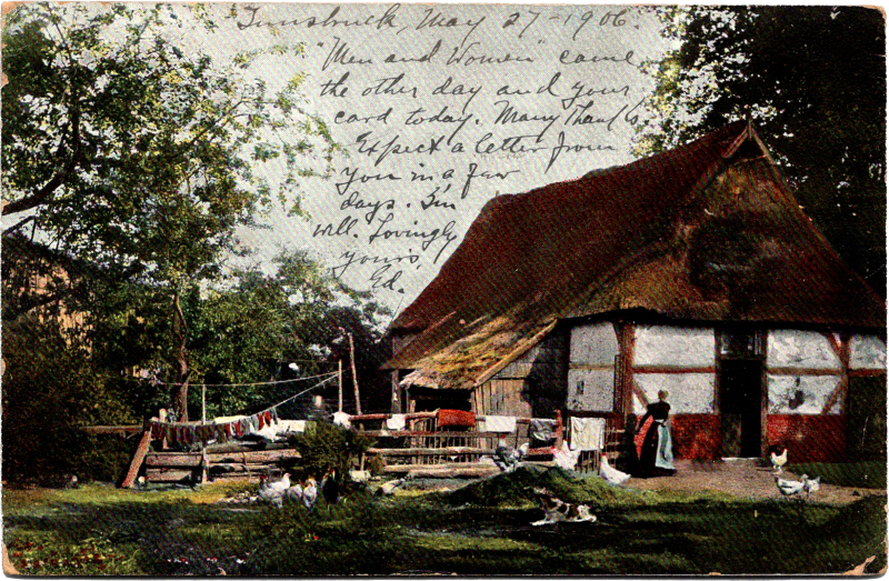 a house with a fence and a person