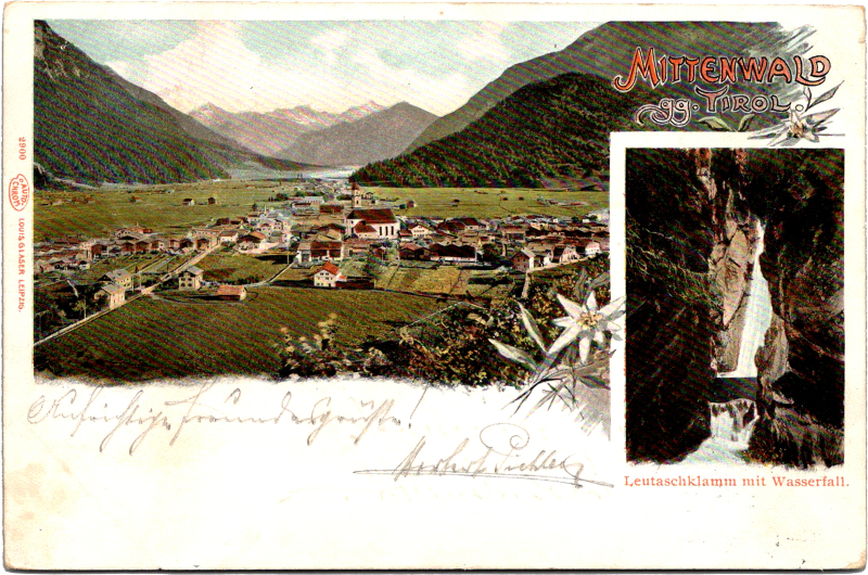 a landscape with mountains and a village