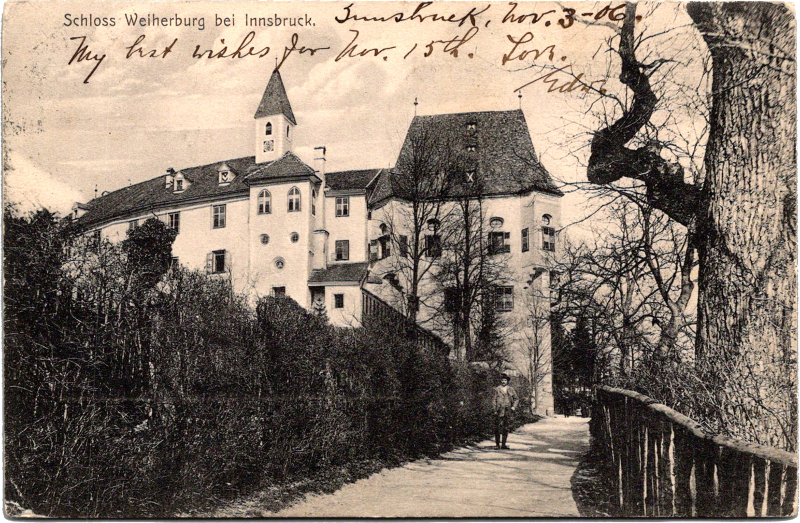 a building with a fence and a path