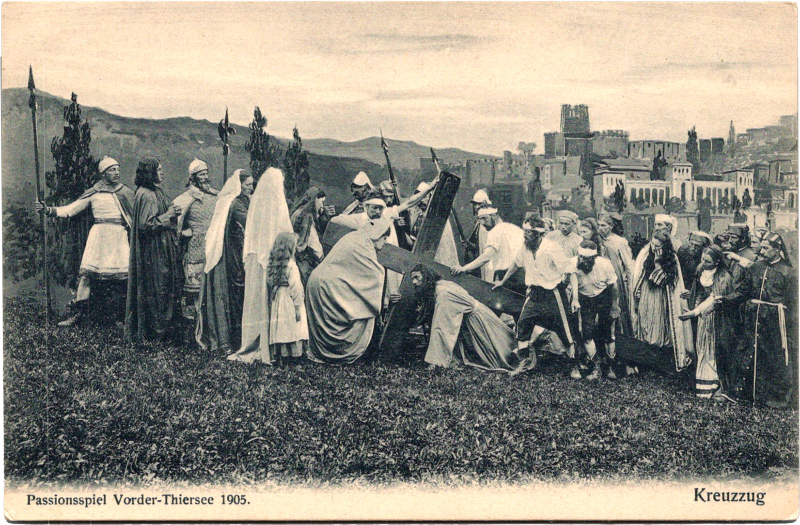 a group of people carrying a cross