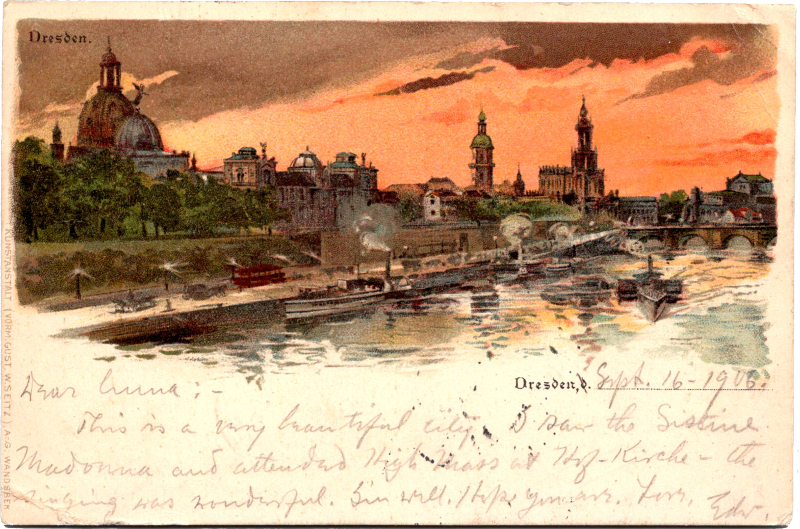 a postcard with a city and a river