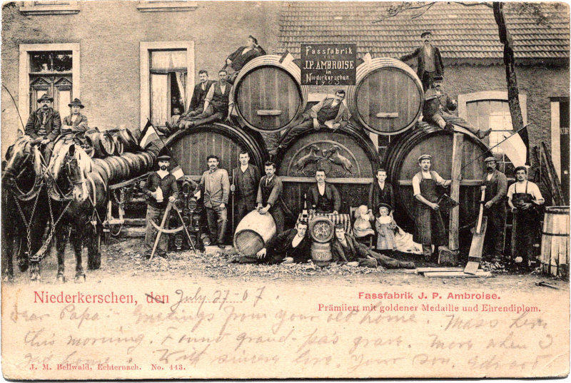 a group of men standing next to barrels