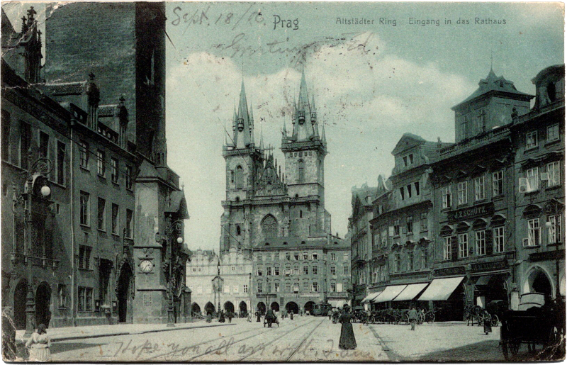 a black and white photo of a street with a castle