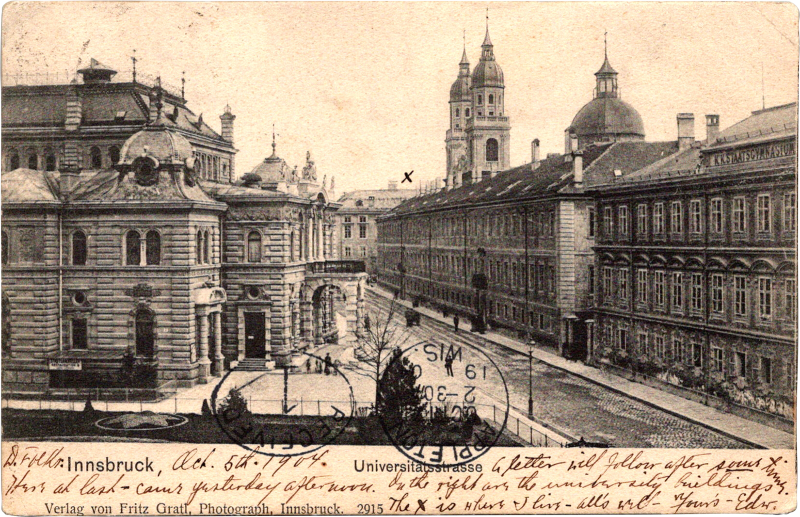 a black and white photo of a street with buildings