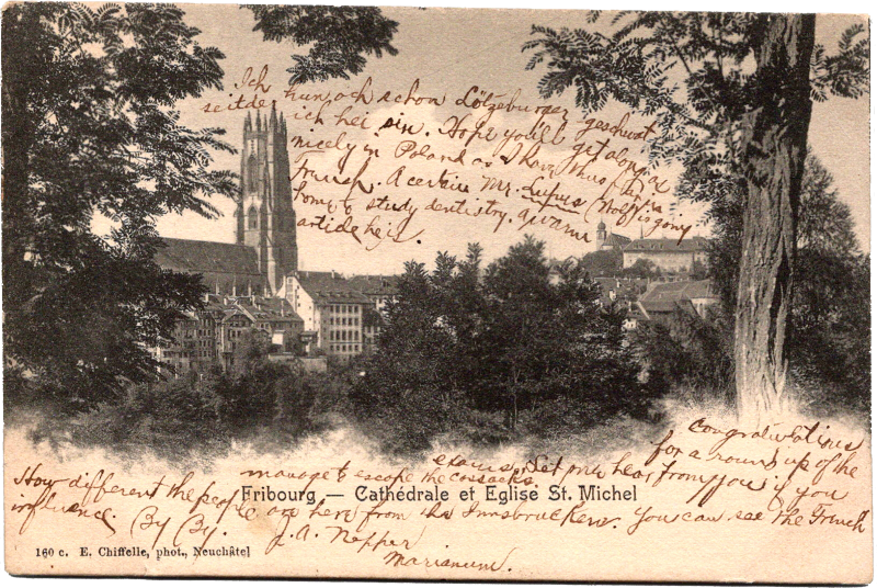 a city with trees and a church