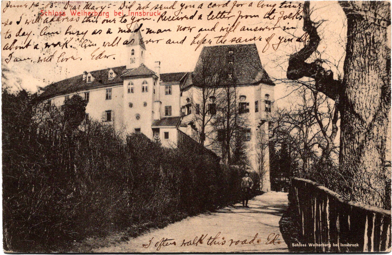 a person walking on a path with a building in the background