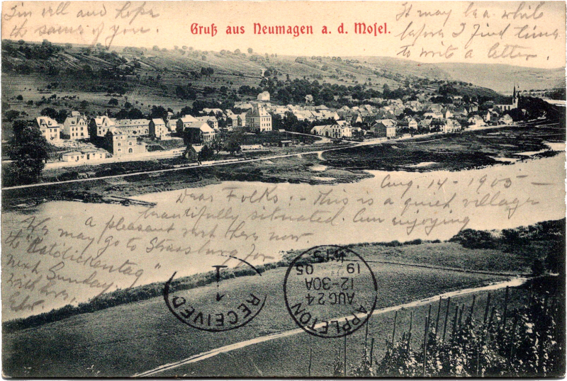 A postcard of a town and a river.