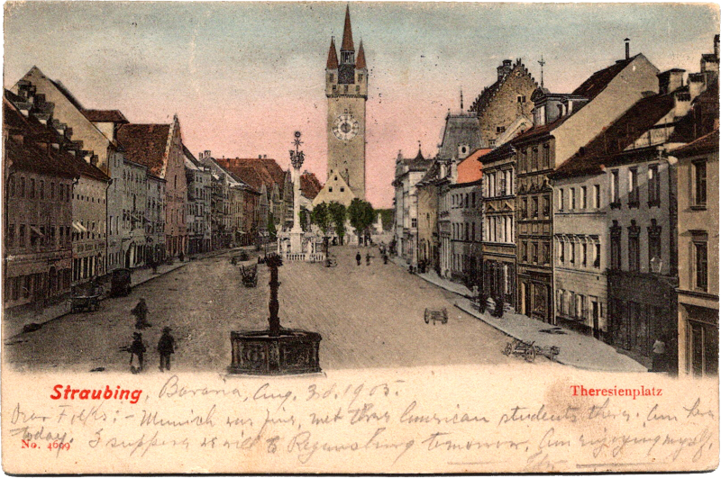 An old postcard of a city with a clock tower.
