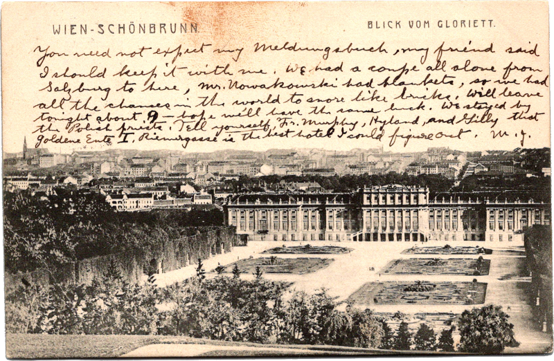 a black and white photo of a building and a garden