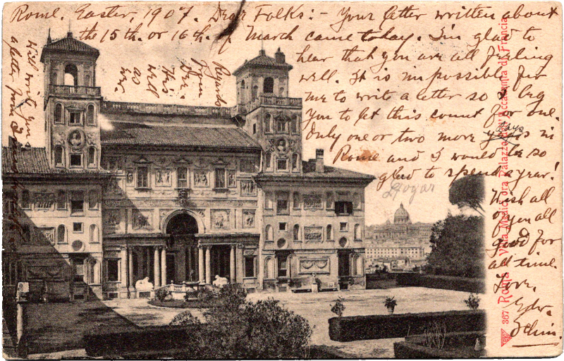 a building with a tower and a garden